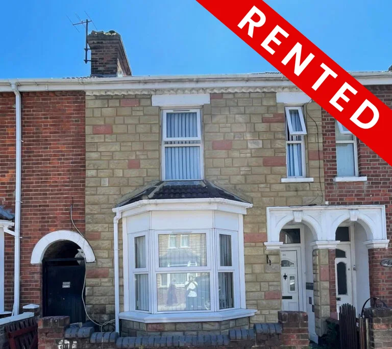 House with "Rented" sign