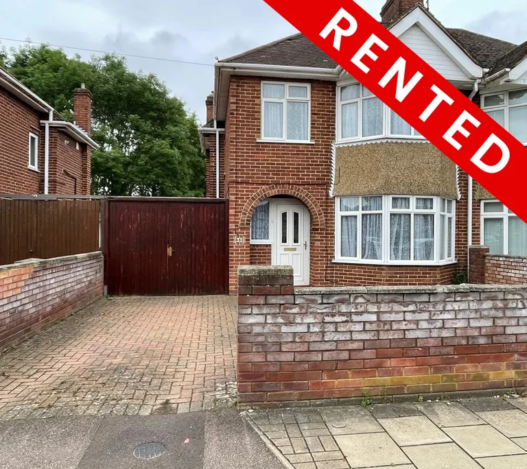 House with "Rented" sign