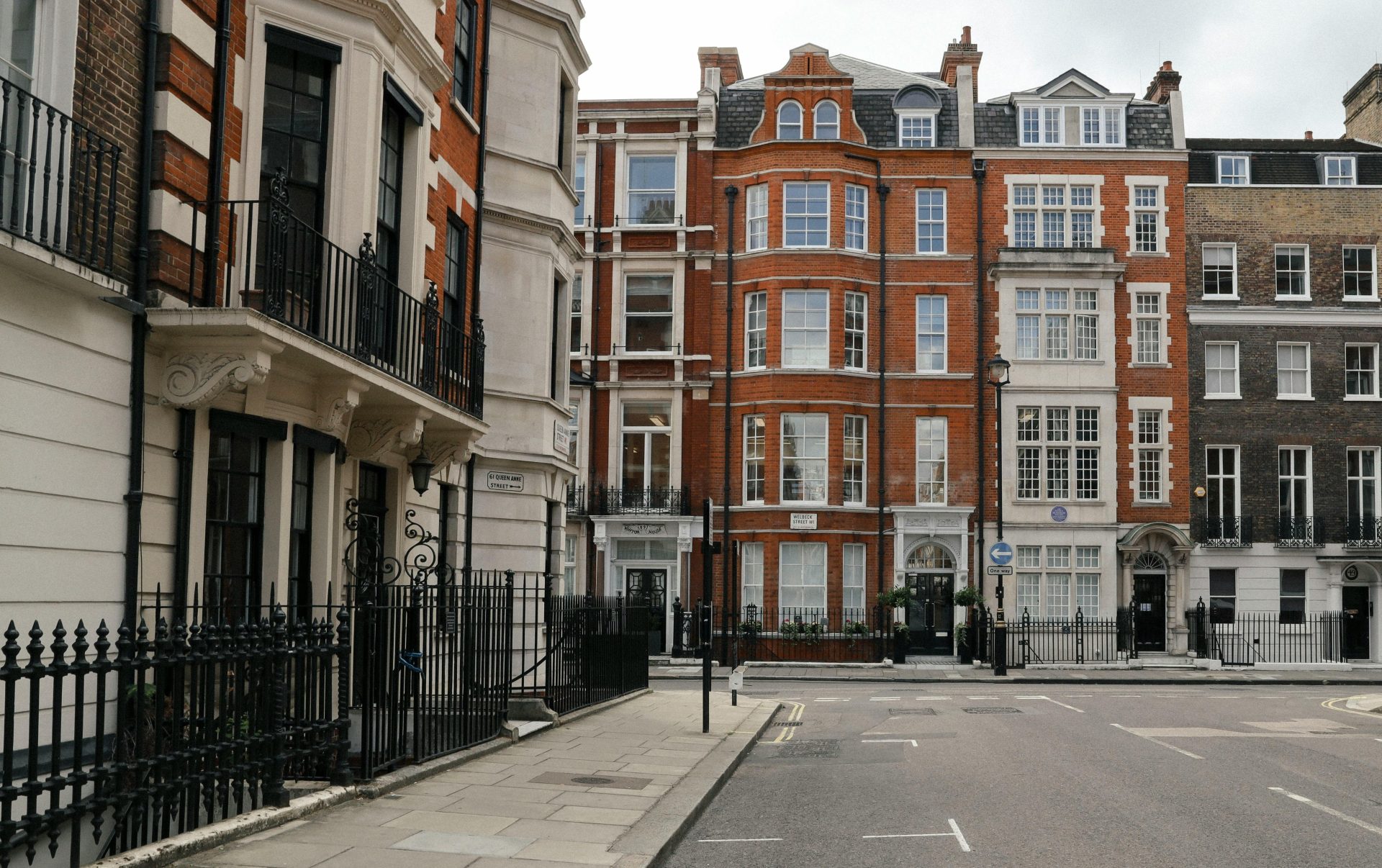 Explore this classic Victorian street scene in central London with iconic red brick facades.