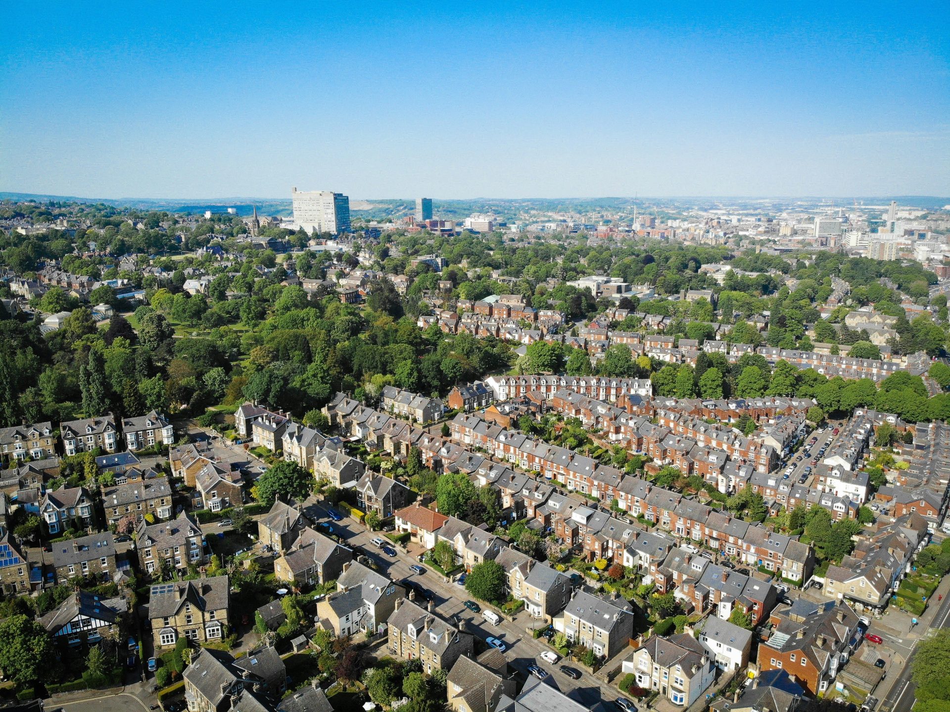 an aerial view of a city with lots of houses